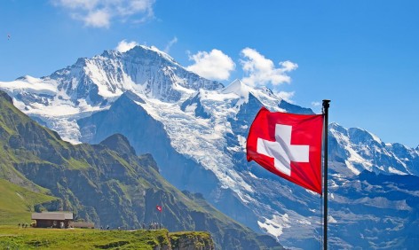 Swiss flag on the top of Mannlichen (Jungfrau region, Bern, Switzerland)