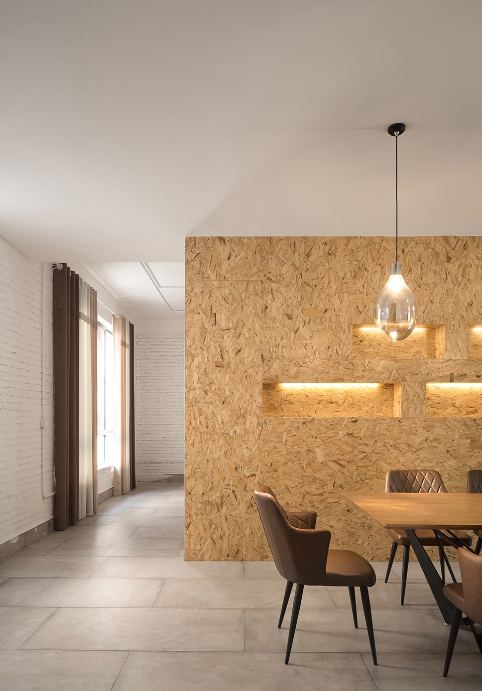 a white hillside house by ming ding spatial art studio