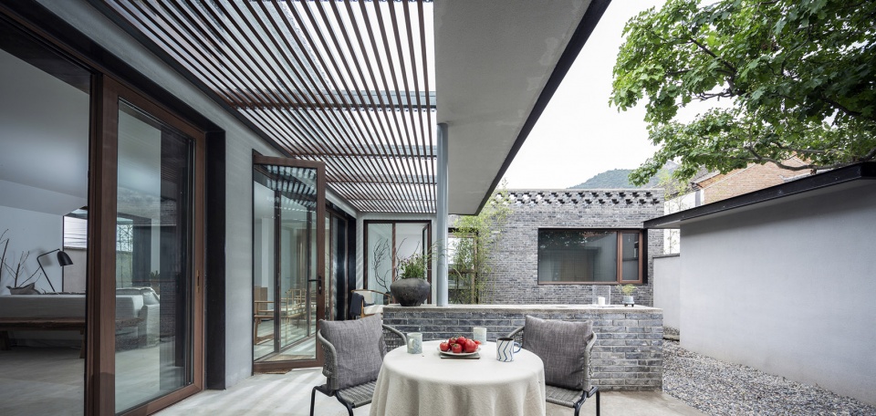 the shared village space evolution of red fruit tree small tavern by evolution design