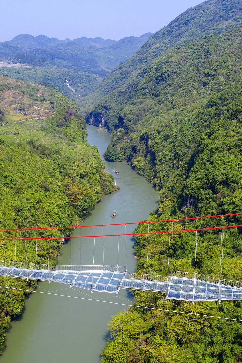 glass bridge in huangchuan three gorges scenic area china by uad