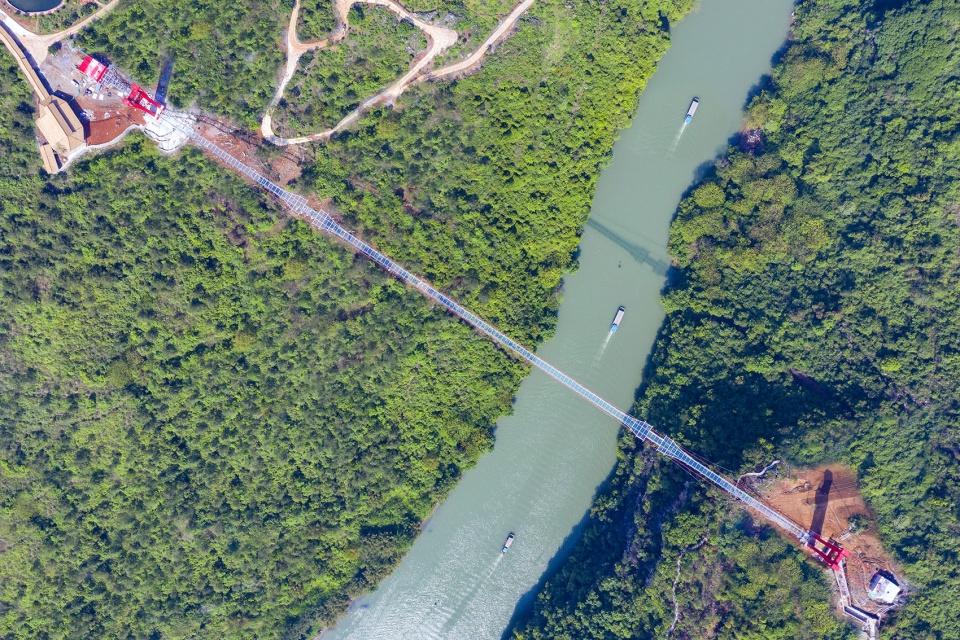 glass bridge in huangchuan three gorges scenic area china by uad