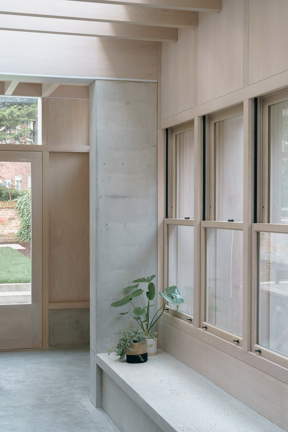 Concrete Plinth House by DGN Studio