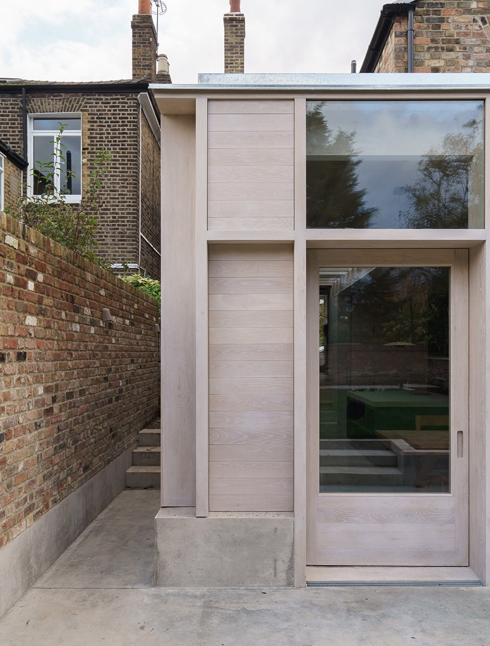 Concrete Plinth House by DGN Studio