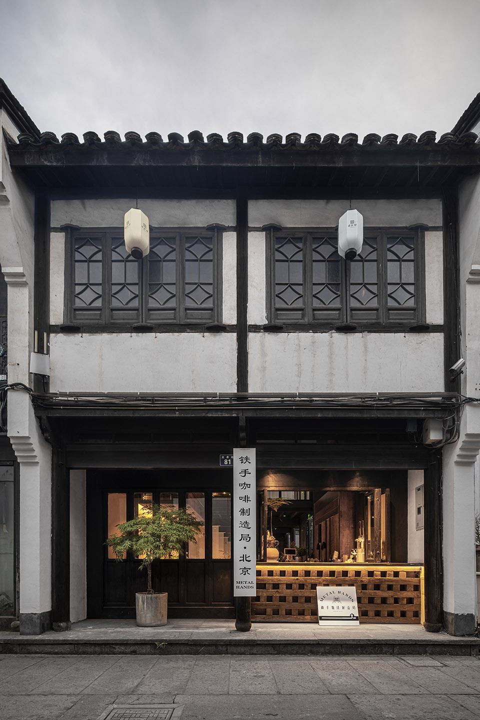 metal hands coffee renovation china by daga architects