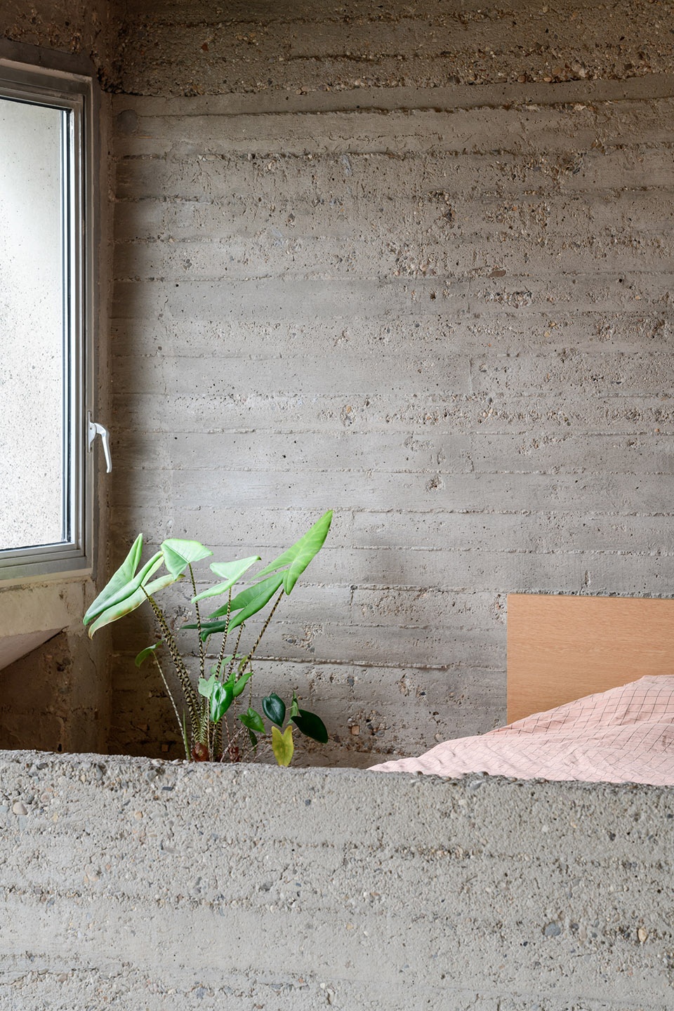 Brutalist duplex apartment in the Riverside Tower by Studio Okami Architects
