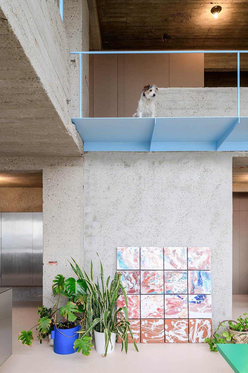 Brutalist duplex apartment in the Riverside Tower by Studio Okami Architects