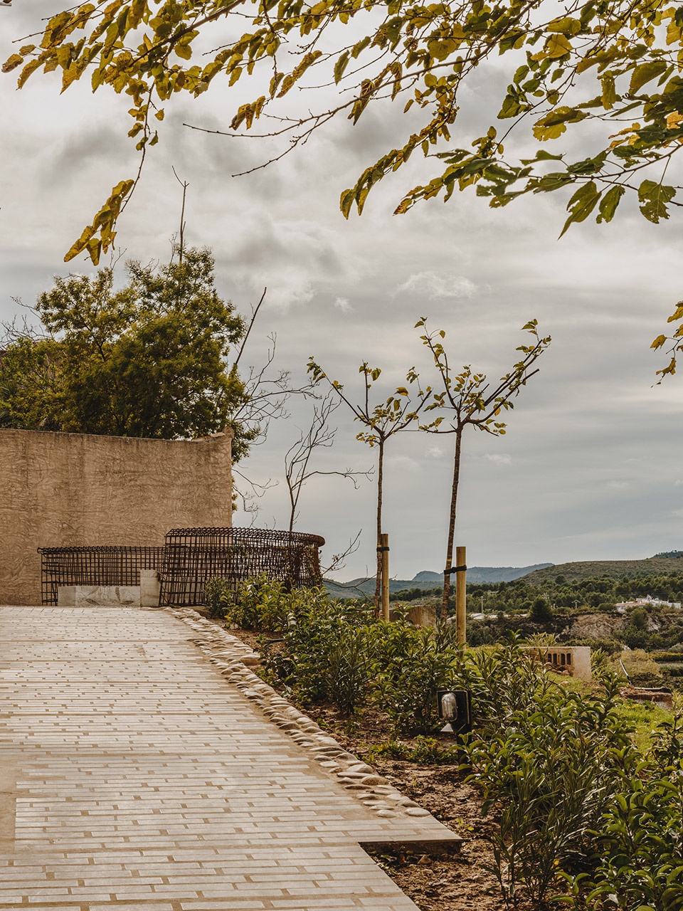 a pergola open to the fields by bona fide taller