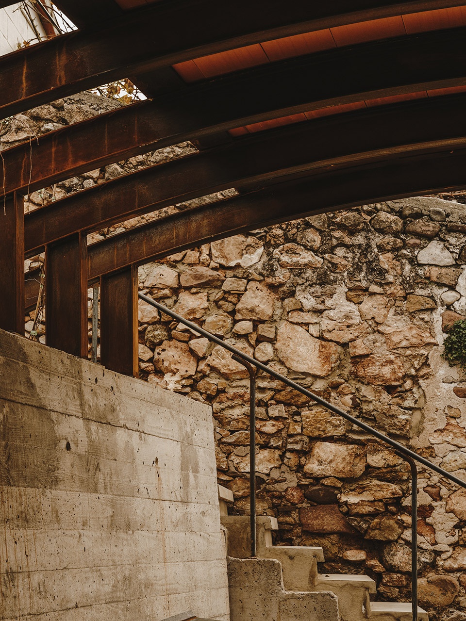 a pergola open to the fields by bona fide taller