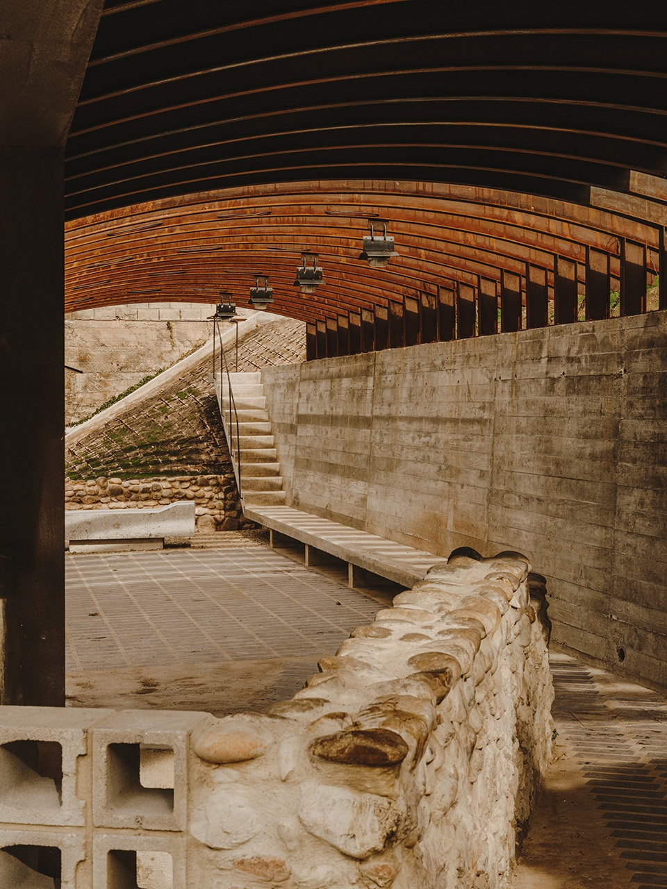 a pergola open to the fields by bona fide taller