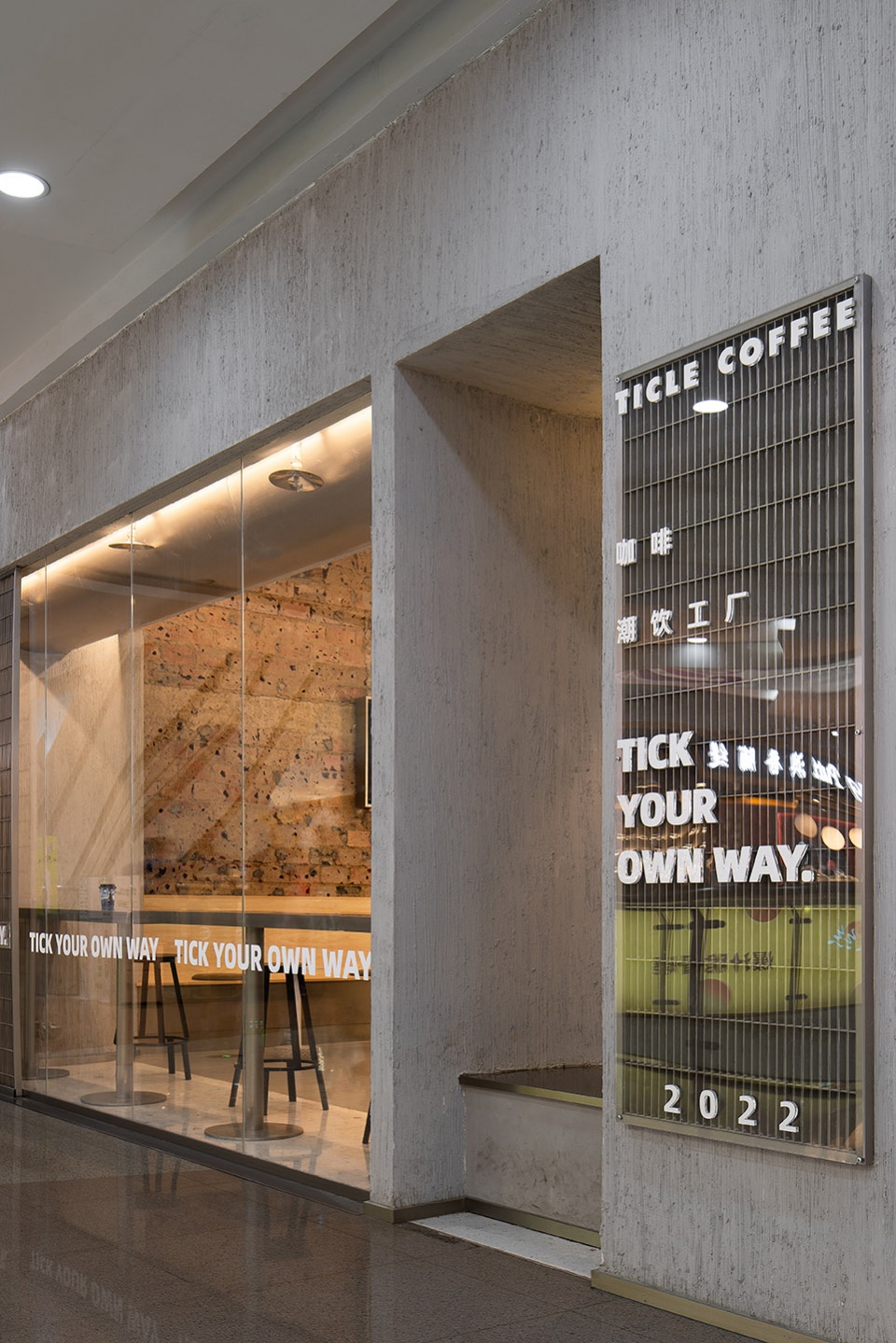 stainless steel and concrete intertwined ticle coffee series by daga architecture