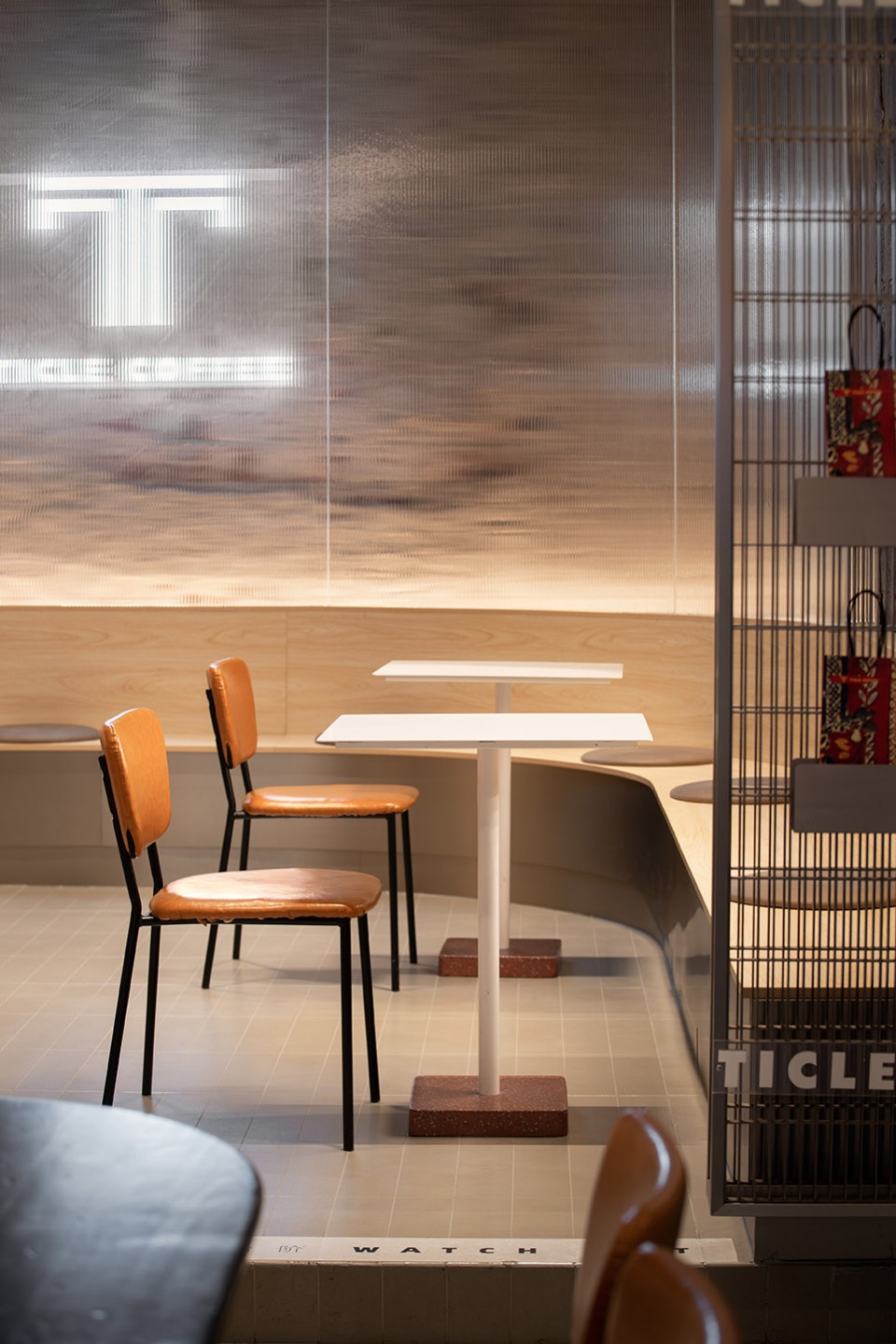 stainless steel and concrete intertwined ticle coffee series by daga architecture