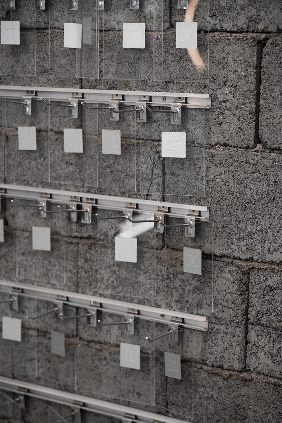 stainless steel and concrete intertwined ticle coffee series by daga architecture