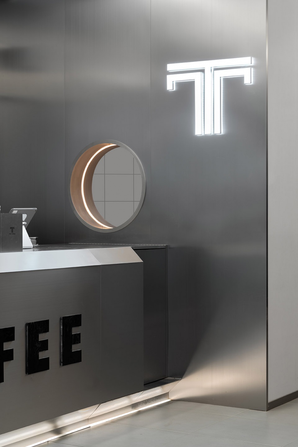 stainless steel and concrete intertwined ticle coffee series by daga architecture