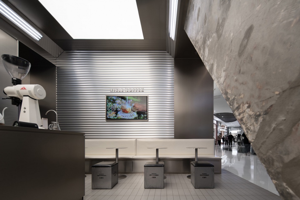 stainless steel and concrete intertwined ticle coffee series by daga architecture