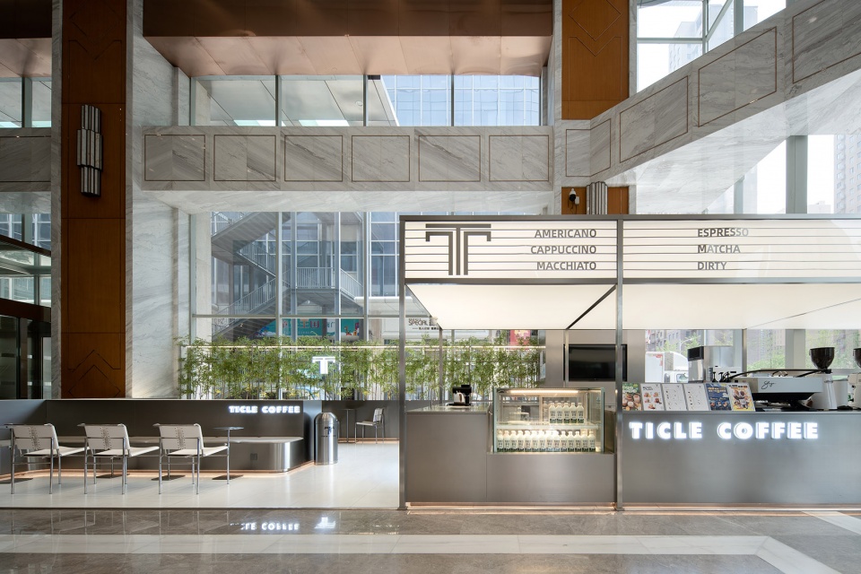 stainless steel and concrete intertwined ticle coffee series by daga architecture