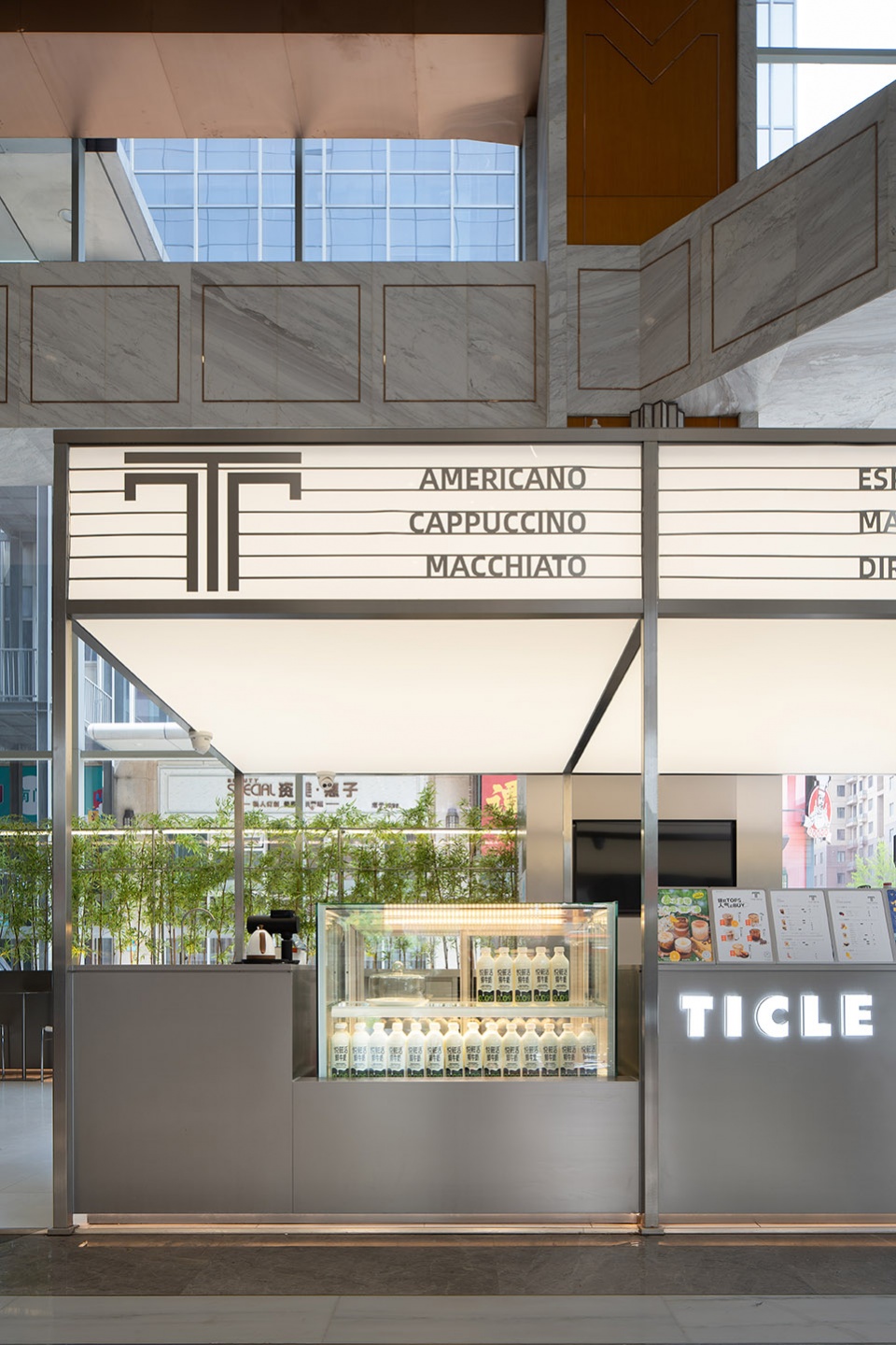 stainless steel and concrete intertwined ticle coffee series by daga architecture