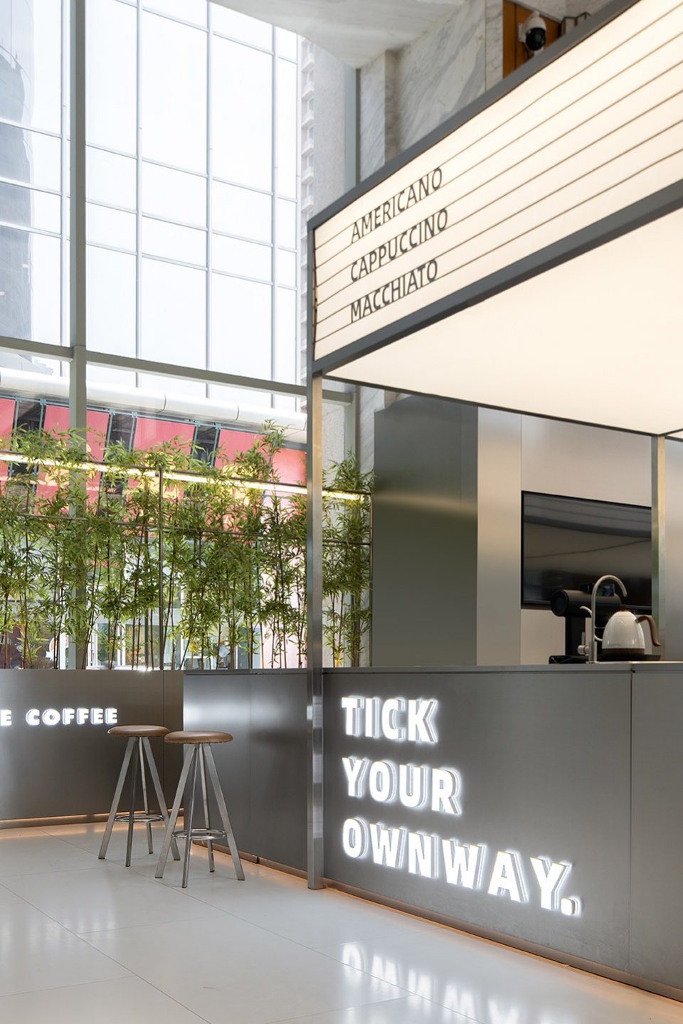 stainless steel and concrete intertwined ticle coffee series by daga architecture
