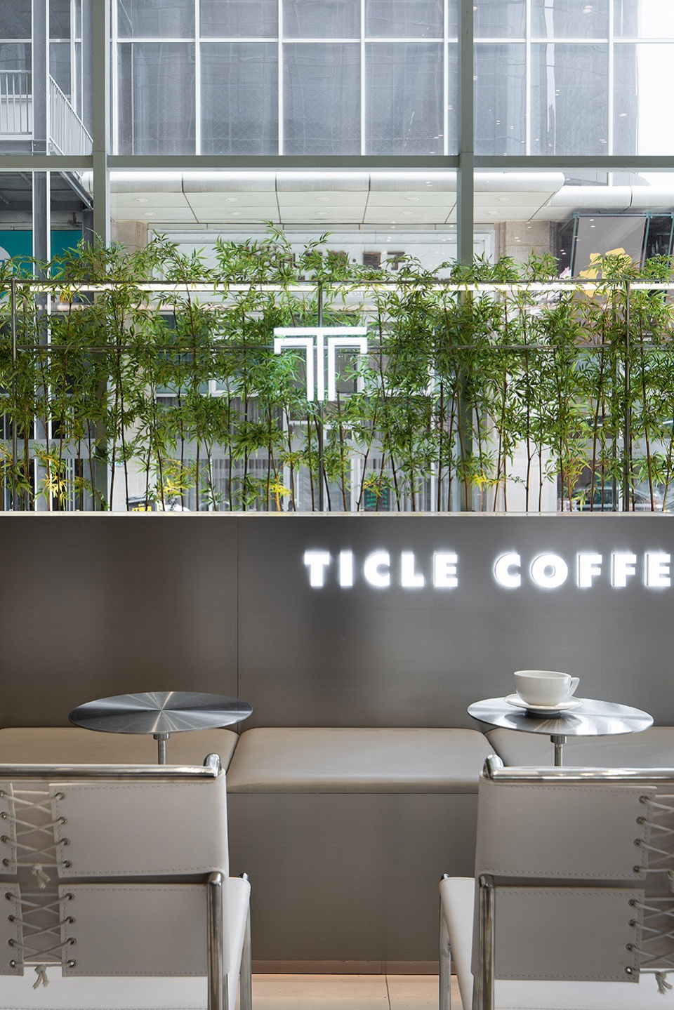 stainless steel and concrete intertwined ticle coffee series by daga architecture