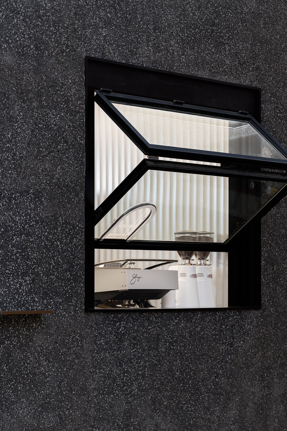 stainless steel and concrete intertwined ticle coffee series by daga architecture