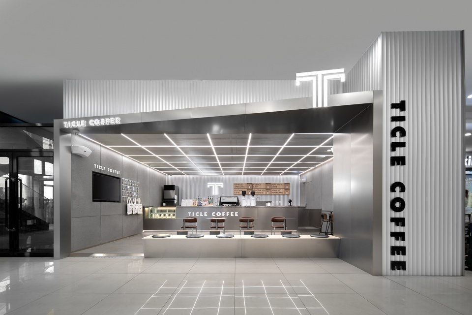 stainless steel and concrete intertwined ticle coffee series by daga architecture