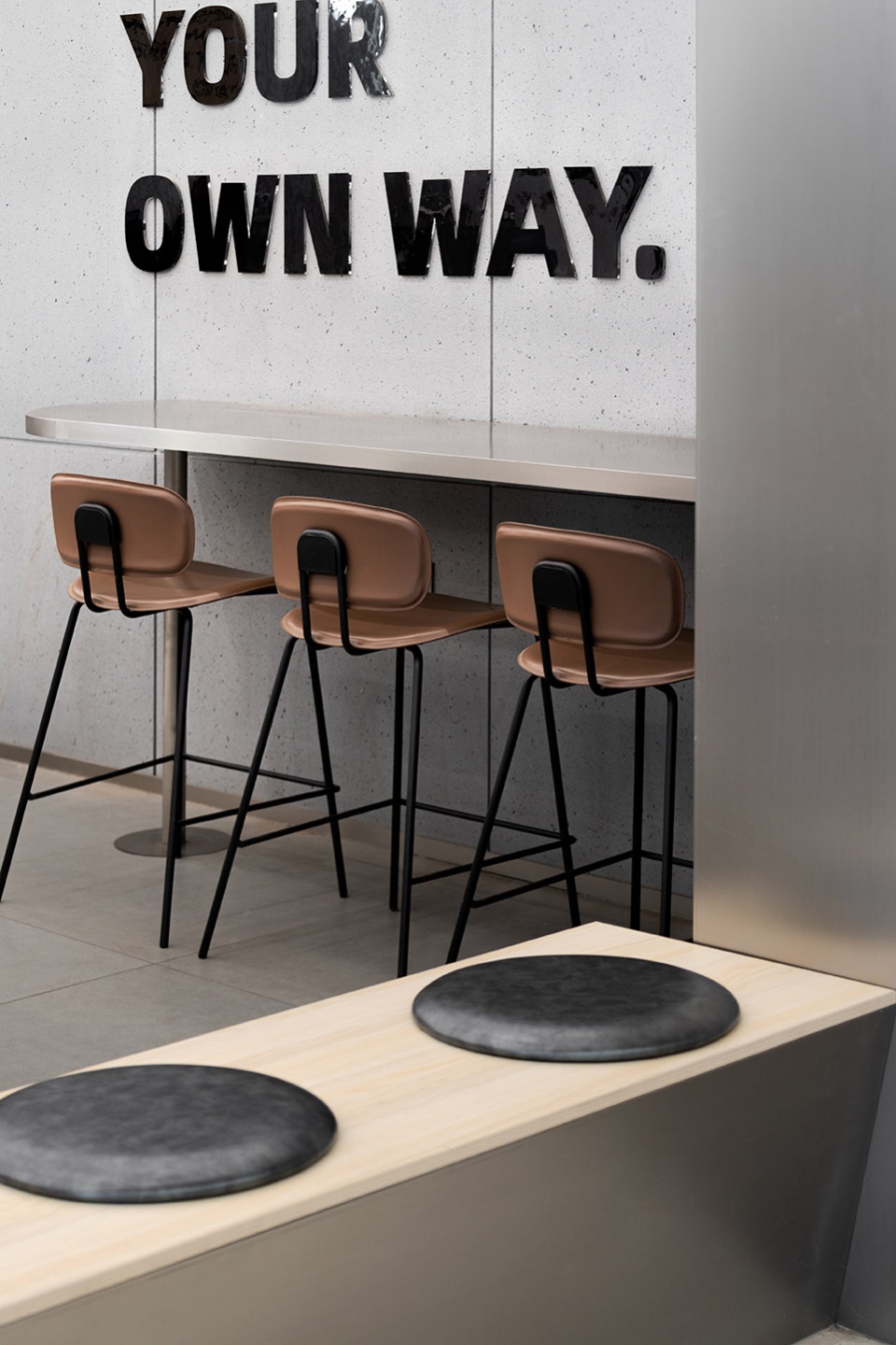 stainless steel and concrete intertwined ticle coffee series by daga architecture