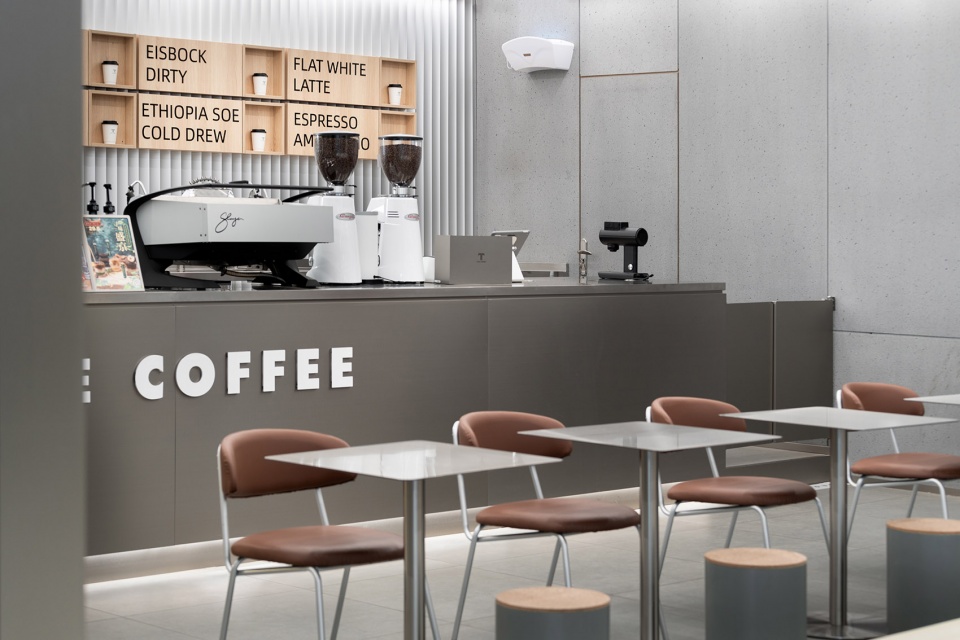 stainless steel and concrete intertwined ticle coffee series by daga architecture