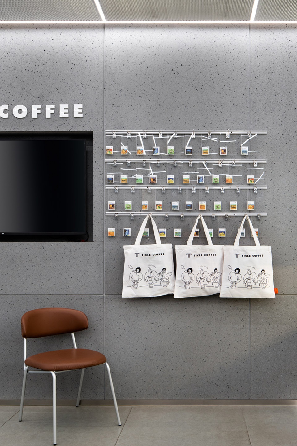 stainless steel and concrete intertwined ticle coffee series by daga architecture