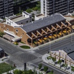 The kindergarten next to the old warehouses by URBANUS