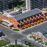 The kindergarten next to the old warehouses by URBANUS