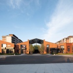 The kindergarten next to the old warehouses by URBANUS