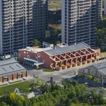 The kindergarten next to the old warehouses by URBANUS