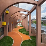 The kindergarten next to the old warehouses by URBANUS