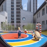 The kindergarten next to the old warehouses by URBANUS