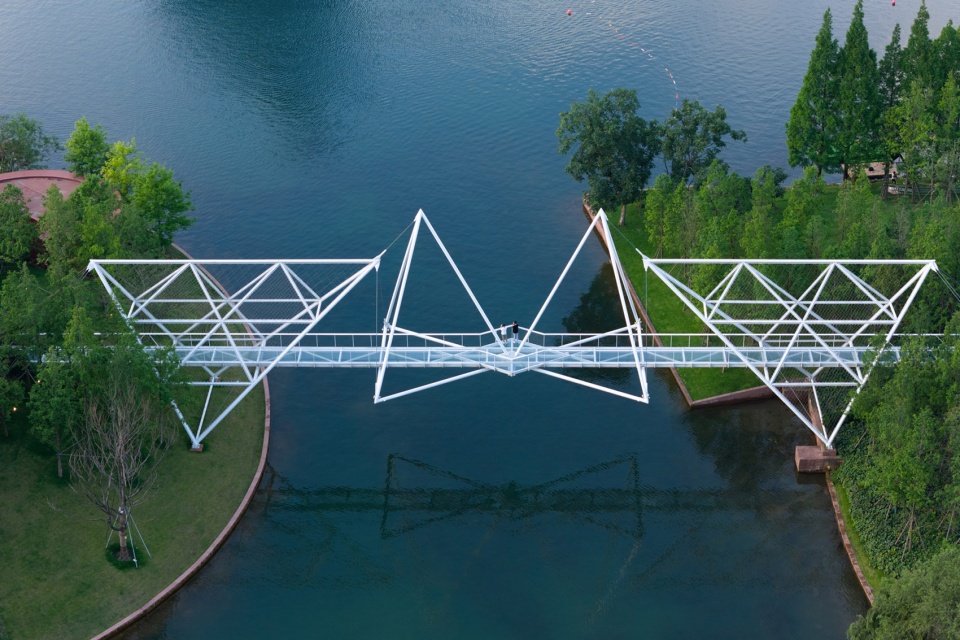 unarchitecte edenland pedestrian bridge in luxelakes by unarchitecte