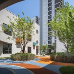 The kindergarten next to the old warehouses by URBANUS