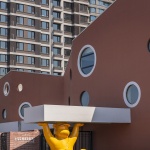 The kindergarten next to the old warehouses by URBANUS
