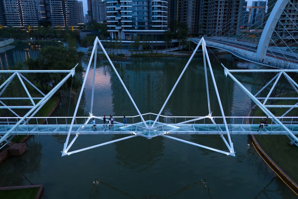 unarchitecte edenland pedestrian bridge in luxelakes by unarchitecte