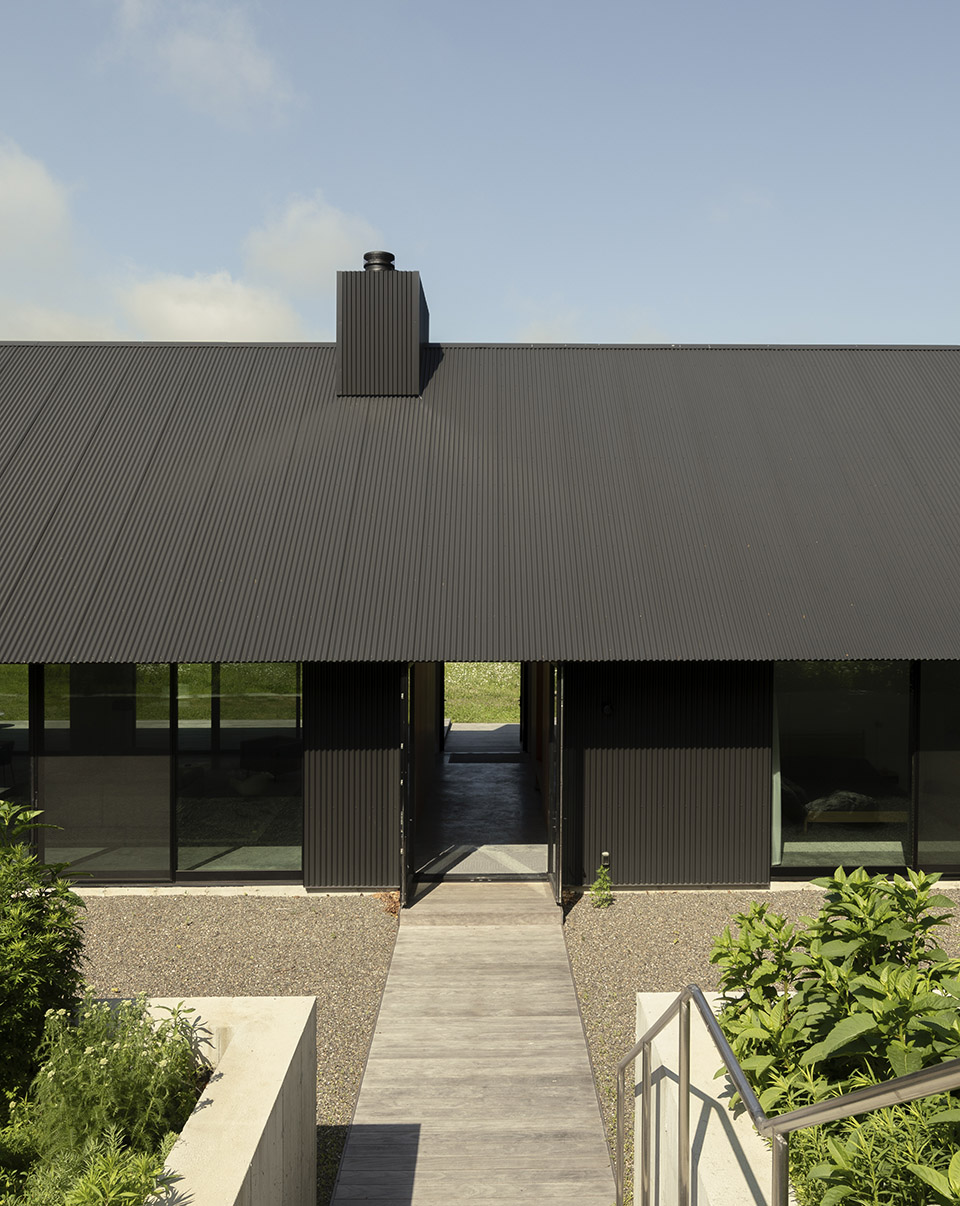 house in a meadow by group projects architecture