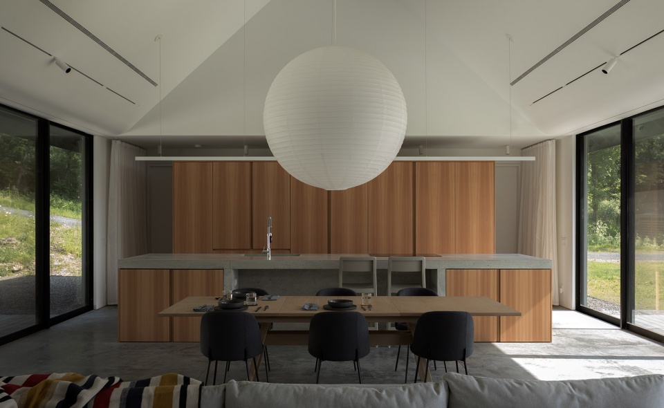 house in a meadow by group projects architecture