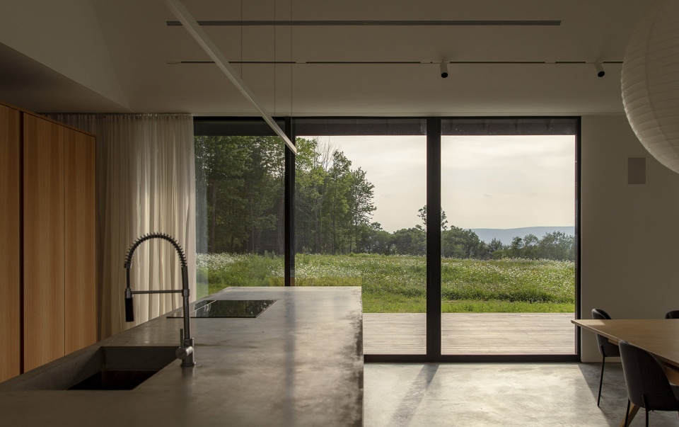 house in a meadow by group projects architecture